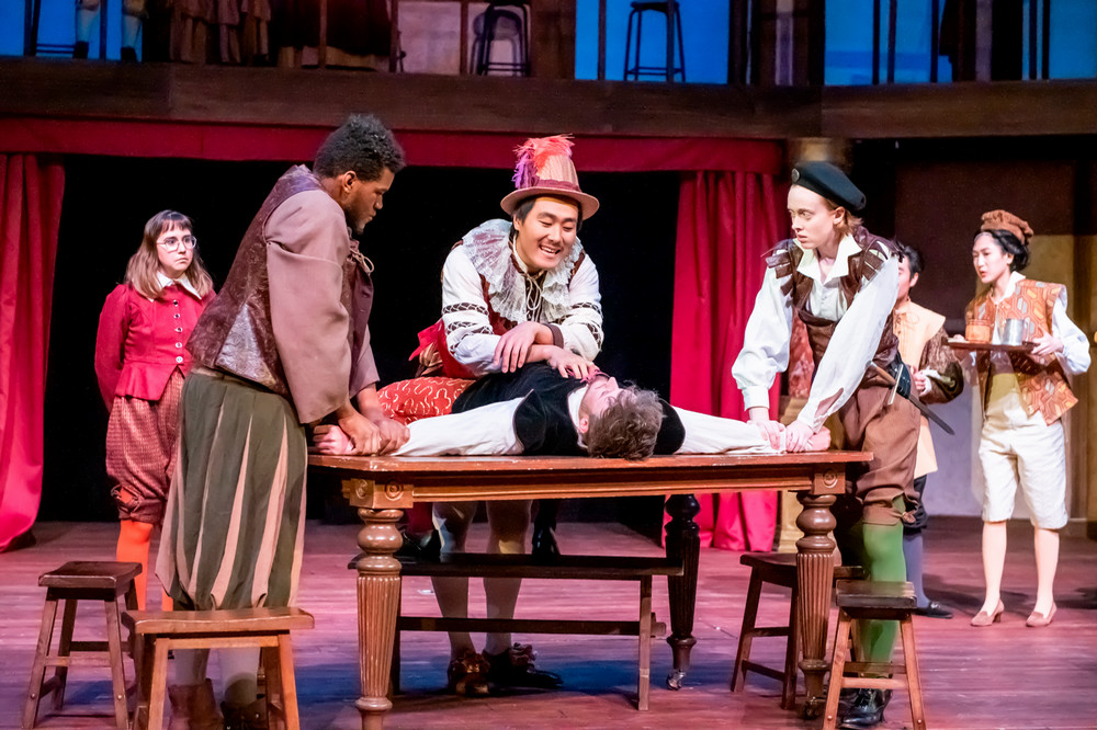 A group of students acting in a performance